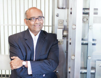 ash patel leans on the vault door looking to the future