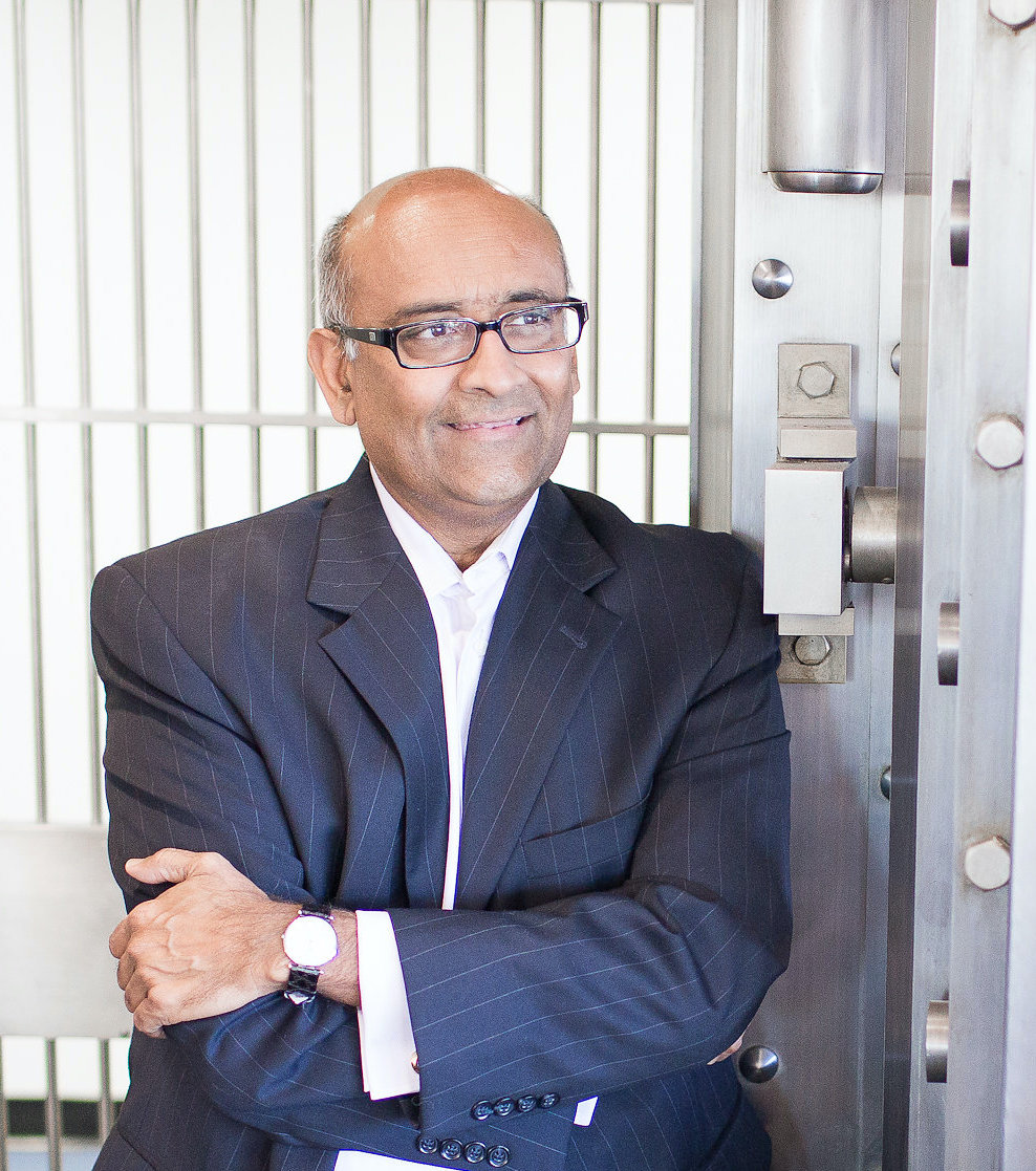 ceo ash patel standing in front of the vault at the bank