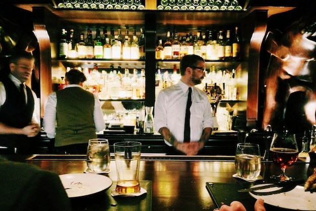 a bartender in a busy restaurant