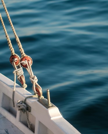 lines tied to the side of a boat